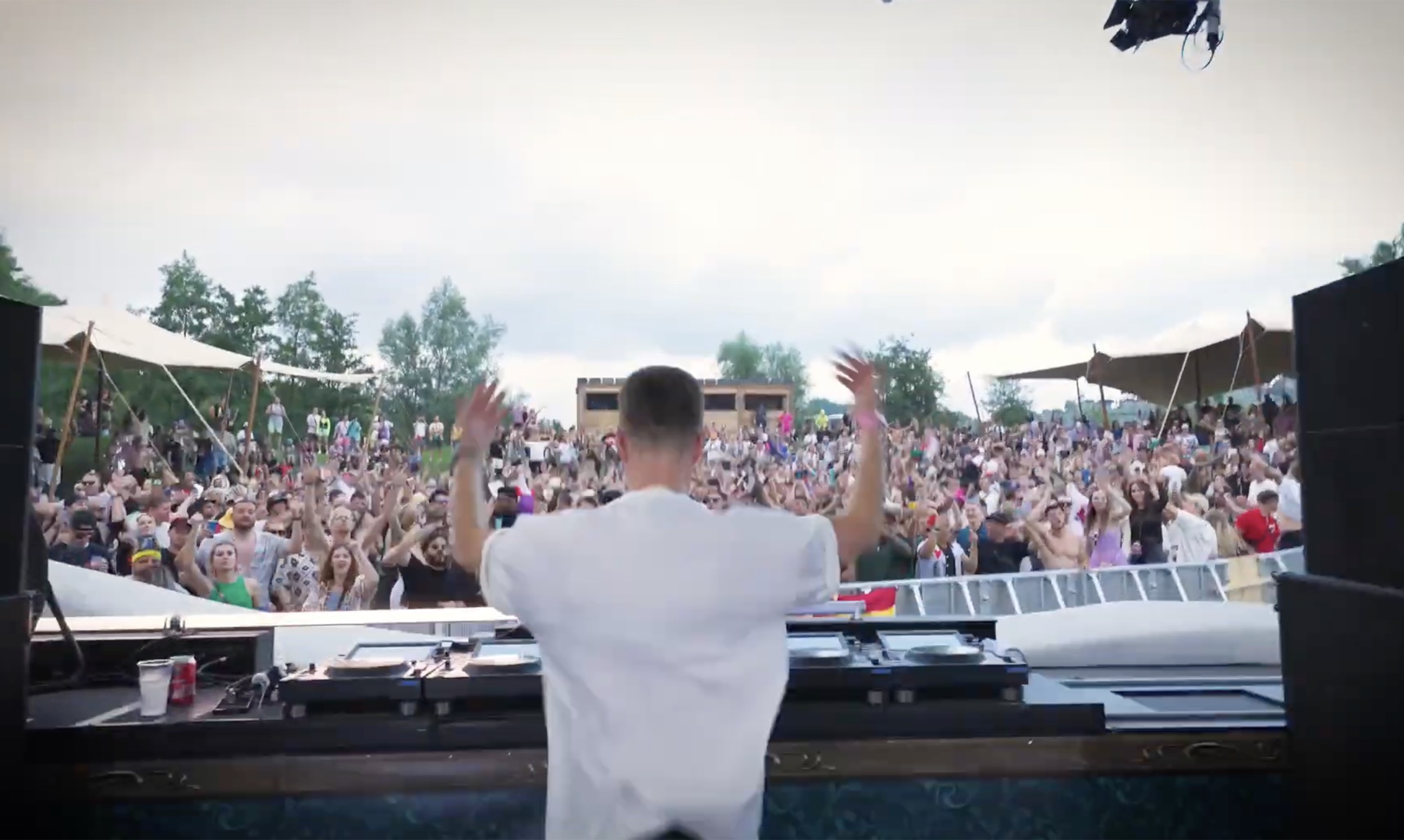 Dannic playing solo in a white T-shirt at Tomorrowland 2024
